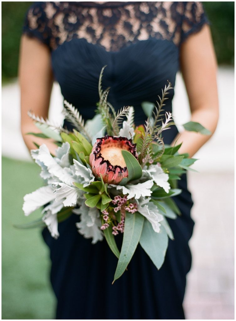 Protea bouquet and navy bridesmaids dresses || The Ganeys