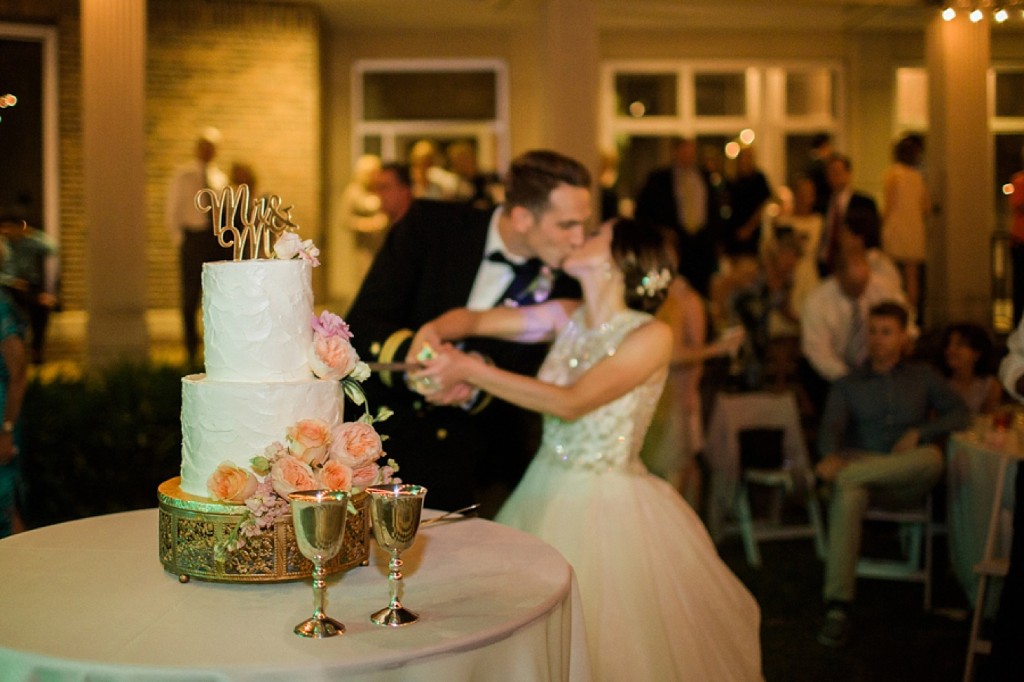 cutting wedding cake with sword