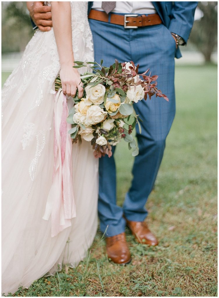 Offwhite wedding dress with bouquet by Ever After Vintage Weddings || The Ganeys