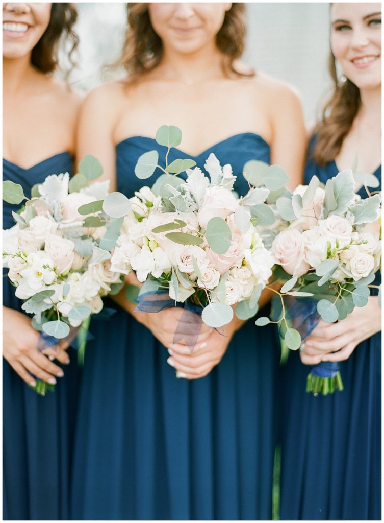 Navy bridesmaids dresses with white and blush bouquets || The Ganeys