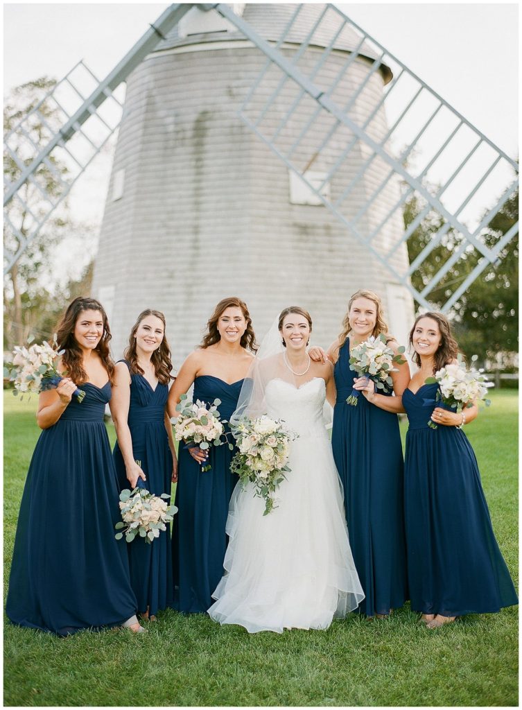Navy bridesmaids dresses with white and blush bouquets at Johnathan Young Windmill on Cape Cod || The Ganeys