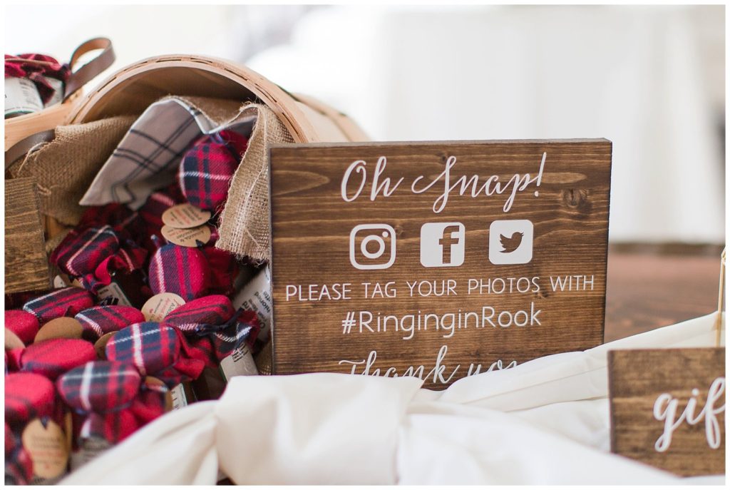 wooden sign at wedding for social media