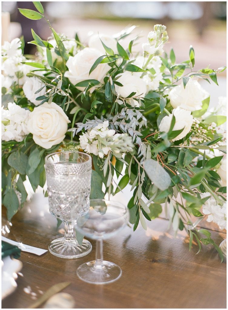 Flowers By Lesley green and white centerpiece with Treasury Rentals glassware || The Ganeys