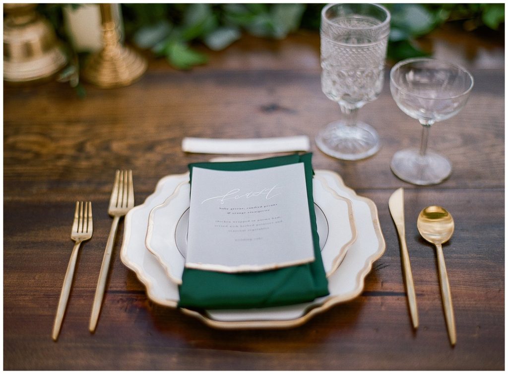 Velum menu from Andi Meija Calligraphy with white and gold plates from Treasury Rentals