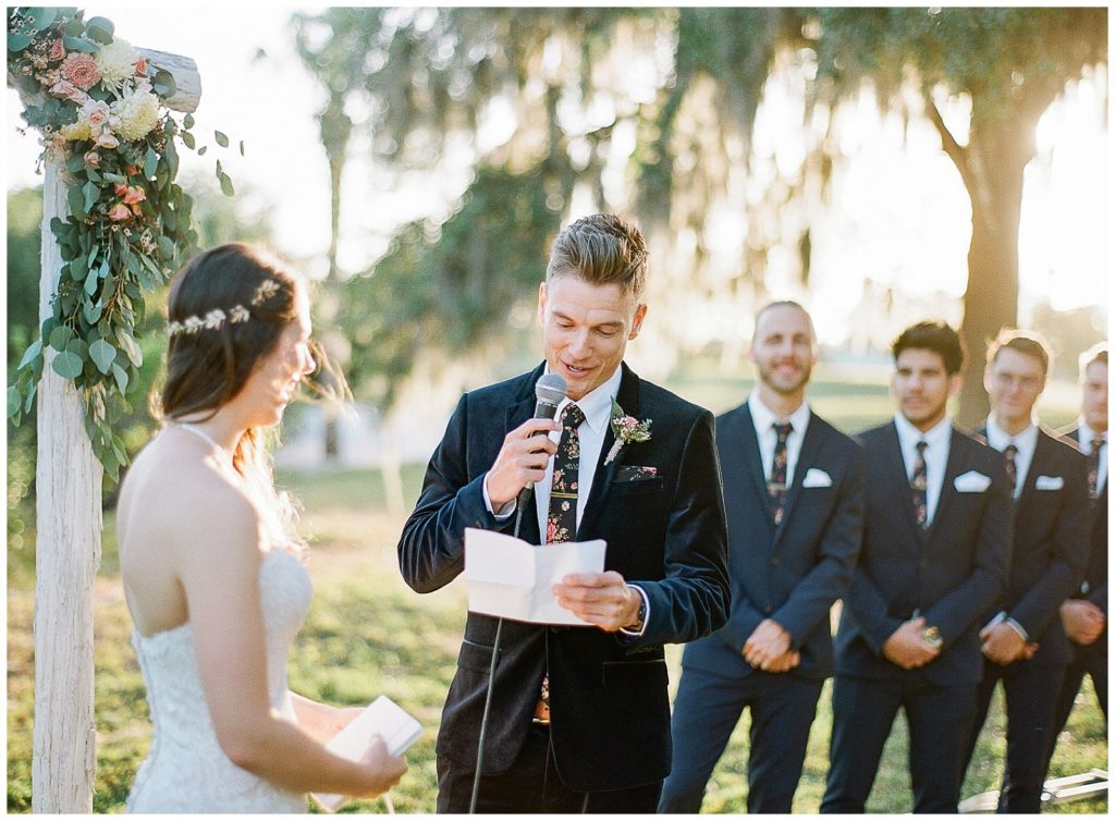 Exchanging hand written vows during wedding ceremony