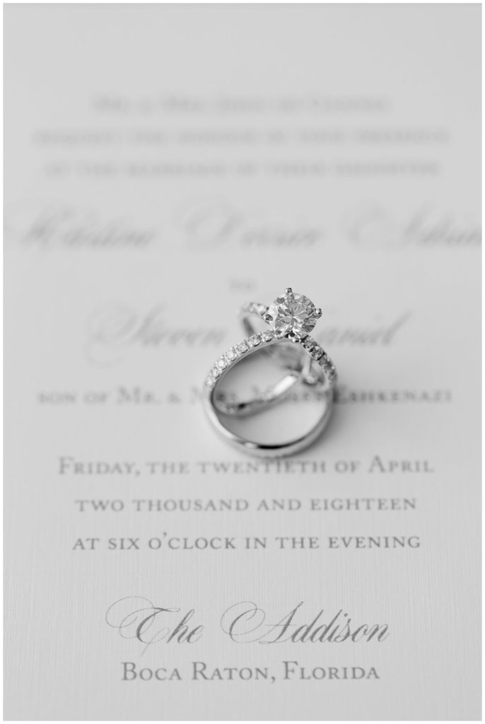 Solitaire diamond ring on wedding invitation at The Addison || The Ganeys