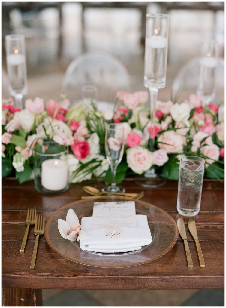 Tropical wedding reception at The Don CeSar with gold rimmed chargers and gold flatware