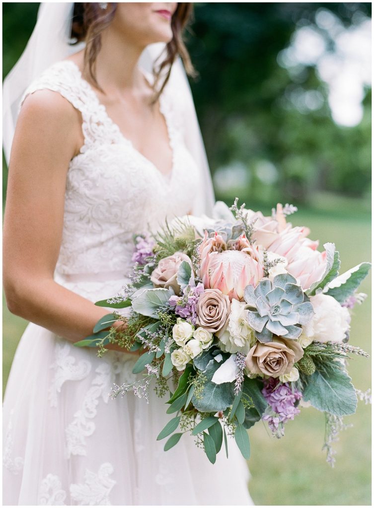 Succulent and protea bouquet by Buds and Blooms for Oneida Country Club Wedding || The Ganeys