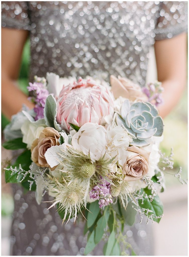 Summer bouquet with lavender, succulent and protea from Buds 'n Blooms, planned by Sash & Bow, Oneida Country Club Wedding || The Ganeys