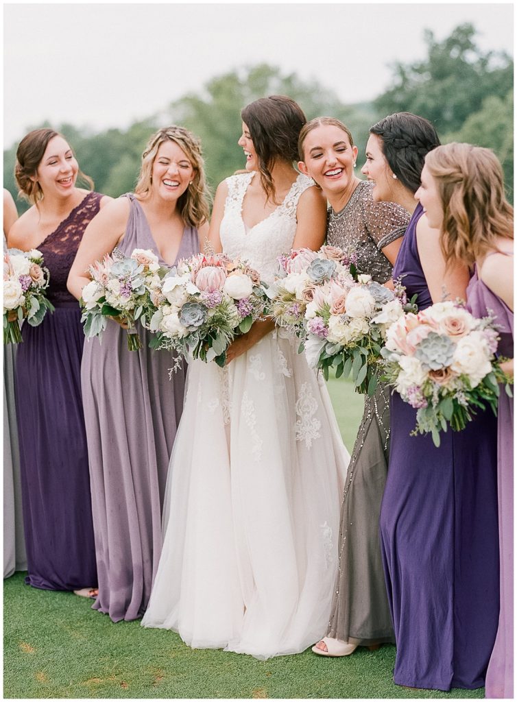 Bridesmaids in shades of purple at the Oneida Country Club Green Bay Wedding || The Ganeys