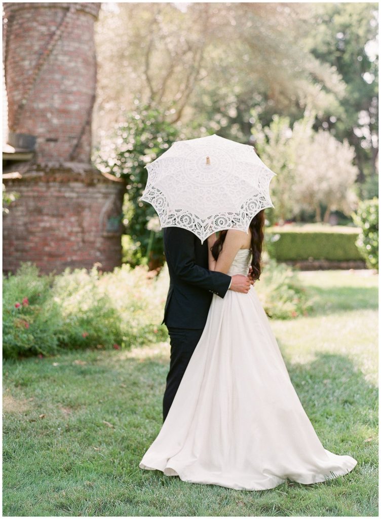 Napa valley wedding at Harvest Inn - Couple with lace umbrella || The Ganeys
