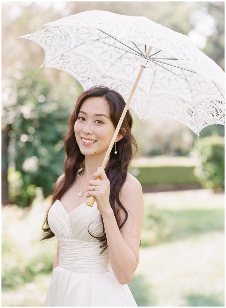 Bride with lace umbrella at Harvest Inn || The Ganeys