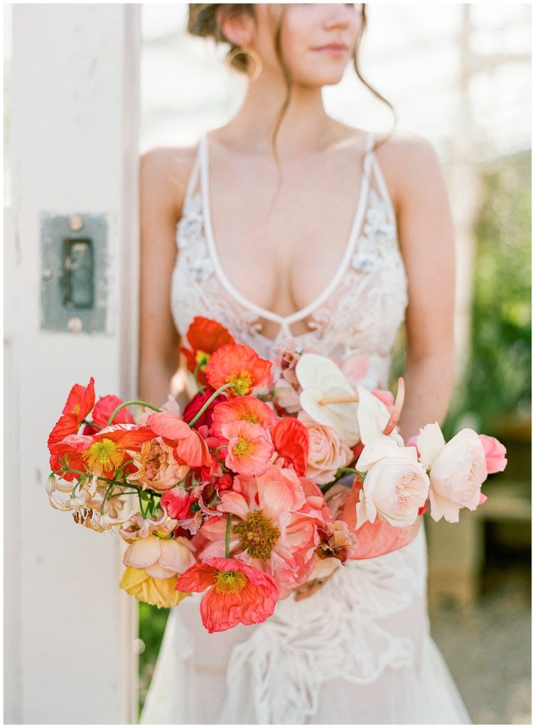 Spring red and orange ombre bouquet with Gather Design Company and Liz Martinez gown at greenhouse in Seattle || The Ganeys