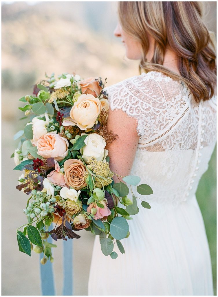 BHLDN wedding dress and topper with Lindsay Helzer bouquet at Smith Rock State Park || The Ganeys