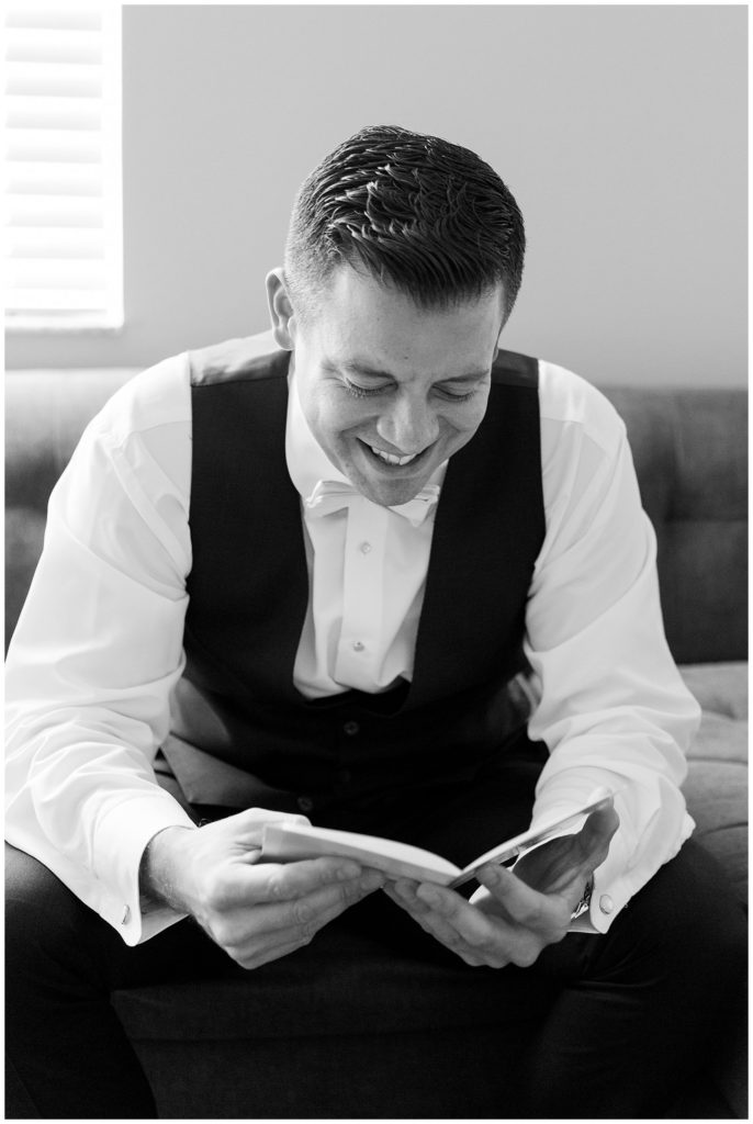 Groom reading letter from bride before Lake Nona Wedding || The Ganeys