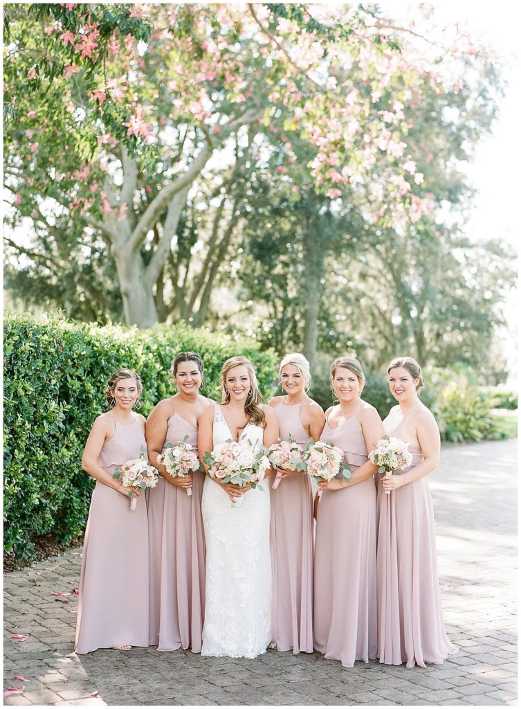 Bridesmaids in mauve Jenny Yoo bridesmaids dresses at Lake Nona Country Club planned by Plan It Events || The Ganeys
