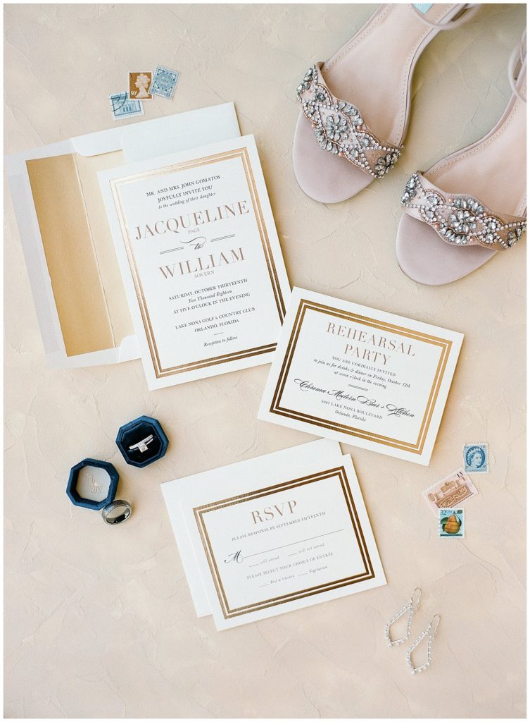 White and gold wedding invitation from Minted with Lacey Byrd Ring Box and Blue by Betsey Johnson Heels || The Ganeys
