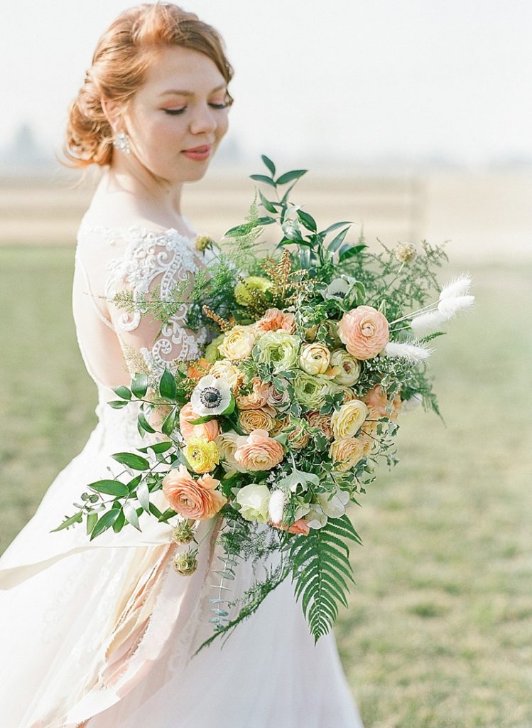 Peach, yellow, and pink wedding bouquet by Sarah's Garden Design for a wedding at The Ranch at Birch Creek || The Ganeys