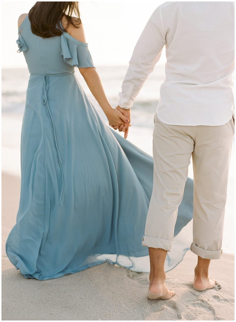 Beach engagement photos with light blue flowy gown in Naples || The Ganeys