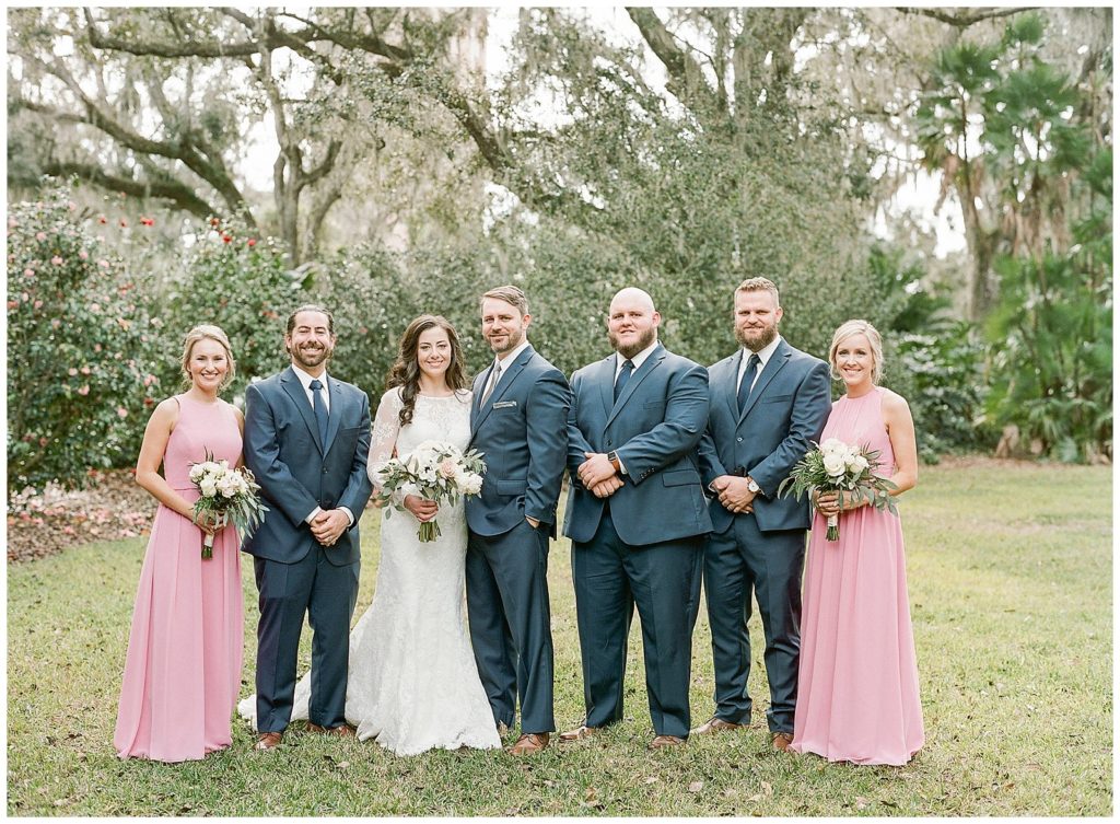 Wedding party in bubble gum pink and navy suits