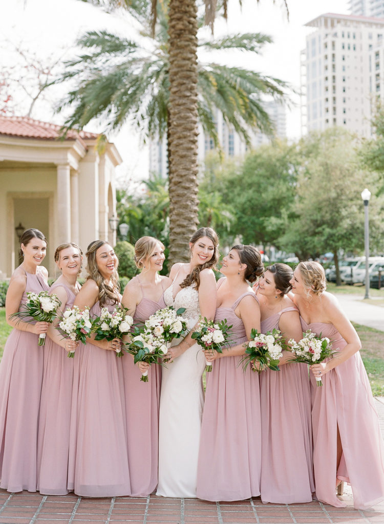Bridesmaids in blush rose Azazie gowns for a wedding at the Museum of Fine Arts St Pete || The Ganeys