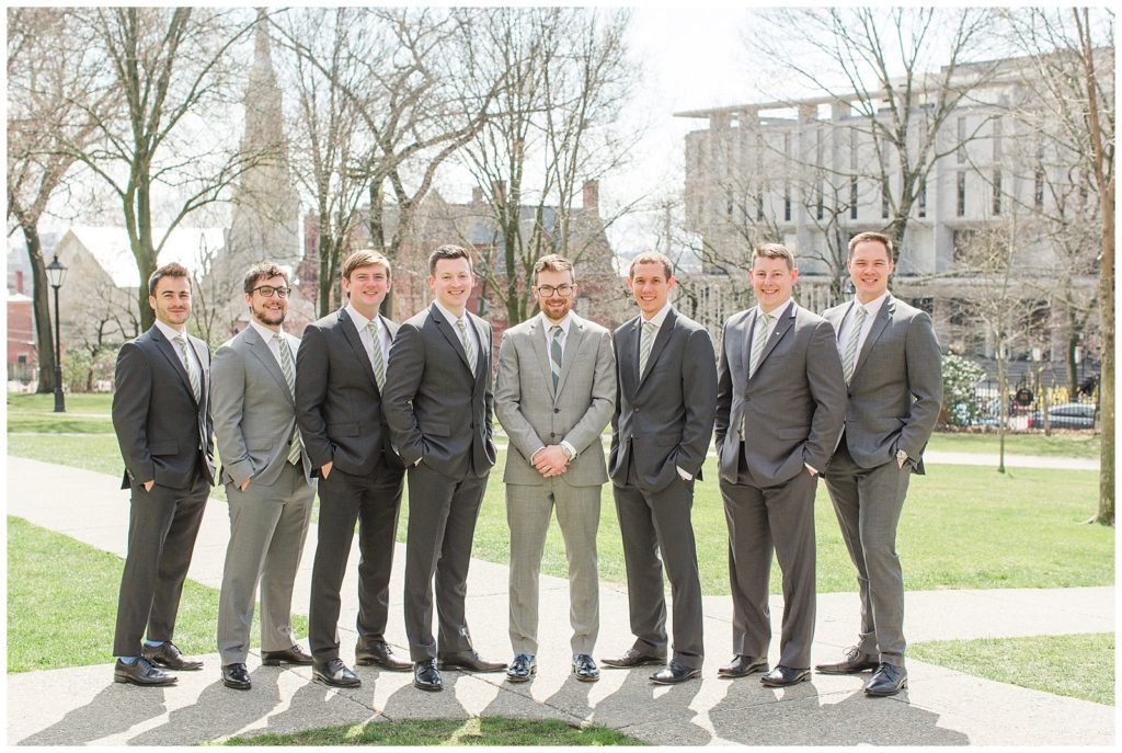 groomsmen in mismatched gray suits