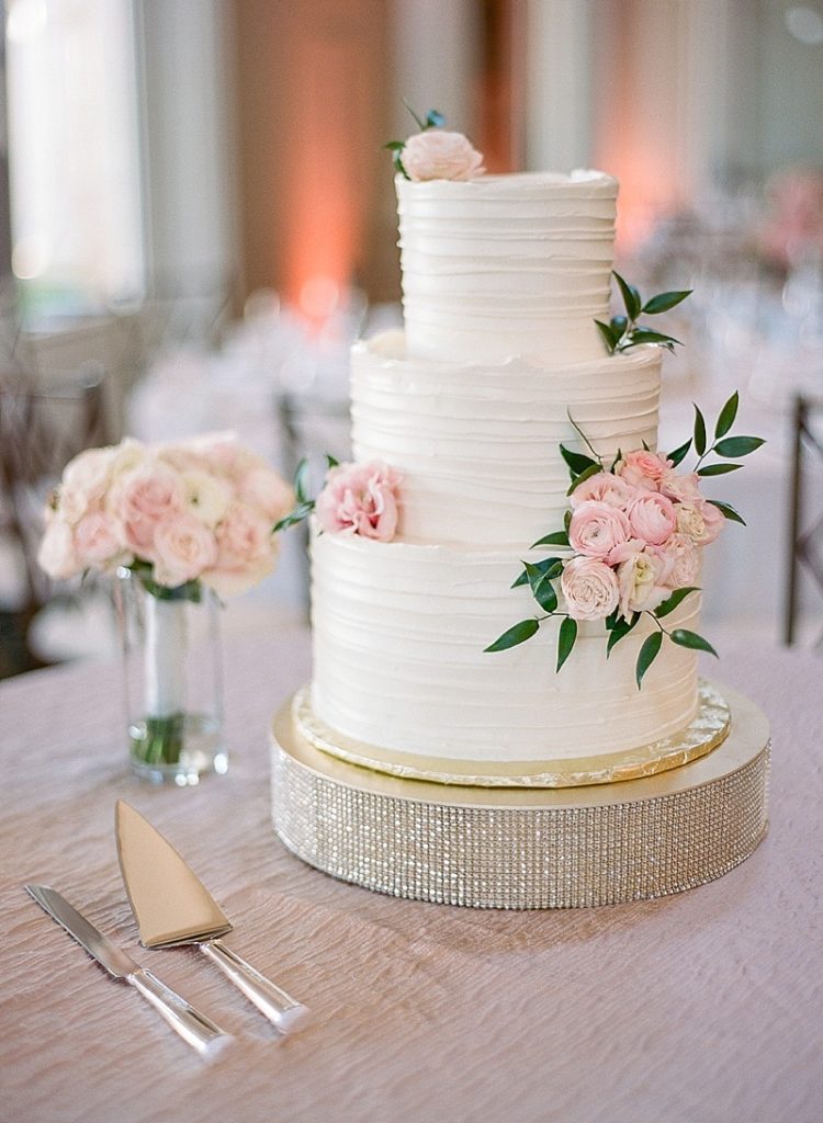 Elegant white wedding cake with flowers for wedding at The Club at Ruby Hill || The Ganeys