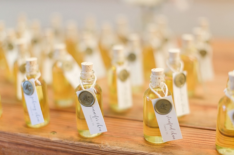 olive oil wedding favors acting as seating chart for Silverado Wedding