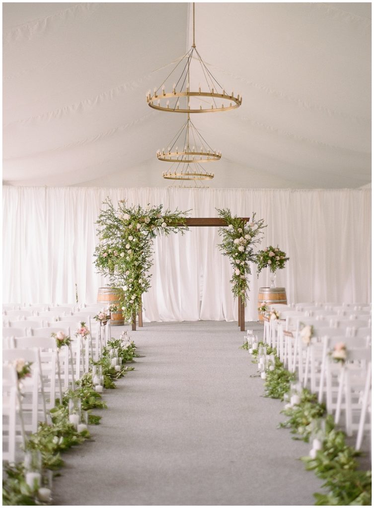 Elegant indoor ceremony setup with greenery for Silverado wedding || The Ganeys