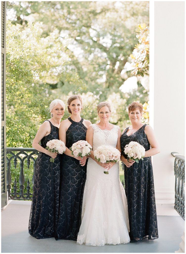 Black and white wedding with black bridesmaids dresses for Nottoway Plantation wedding || The Ganeys
