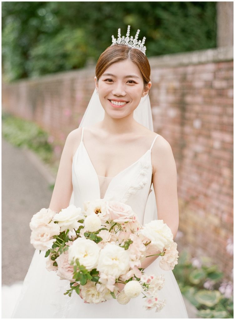 Bride with crown and blush and white bouquet by Gather Design Company || The Ganeys