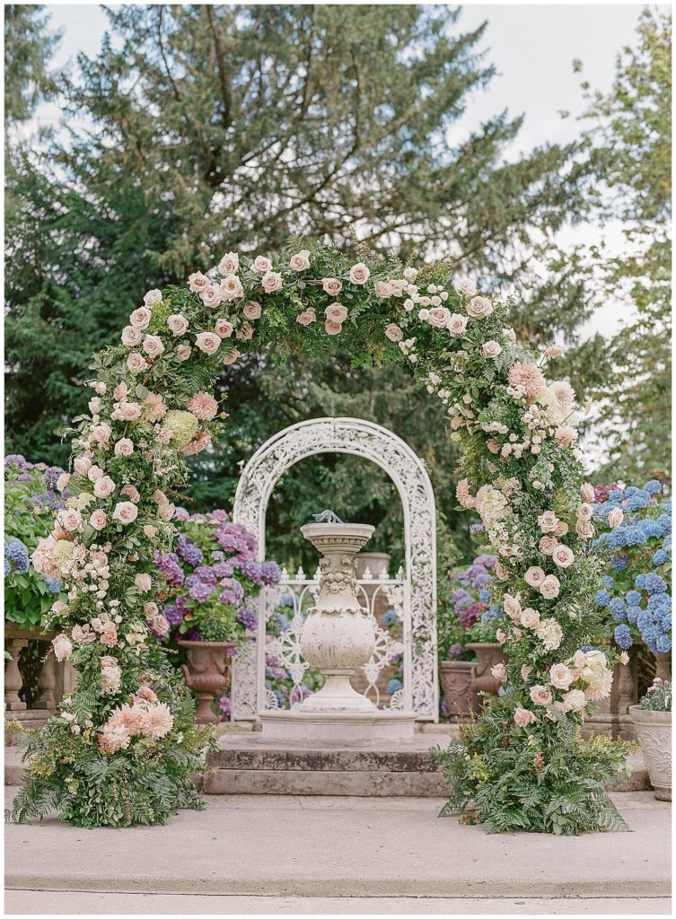 Floral ceremony arch for Thornewood Castle wedding by Gather Design Company || The Ganeys