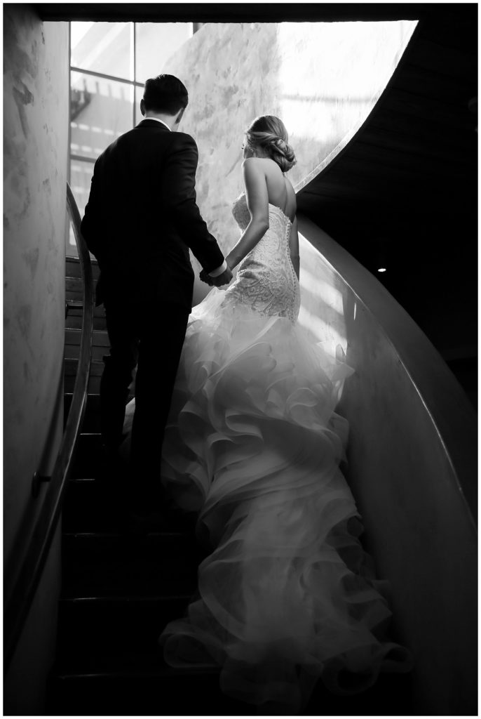 bride and groom walking up stairs at Auberge Du Soleil