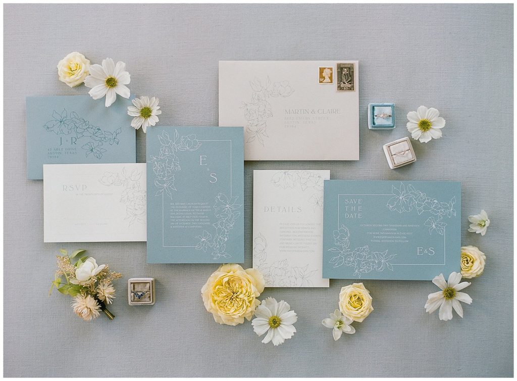 Modern blue wedding invitation with floral details from S Libbrecht Studio