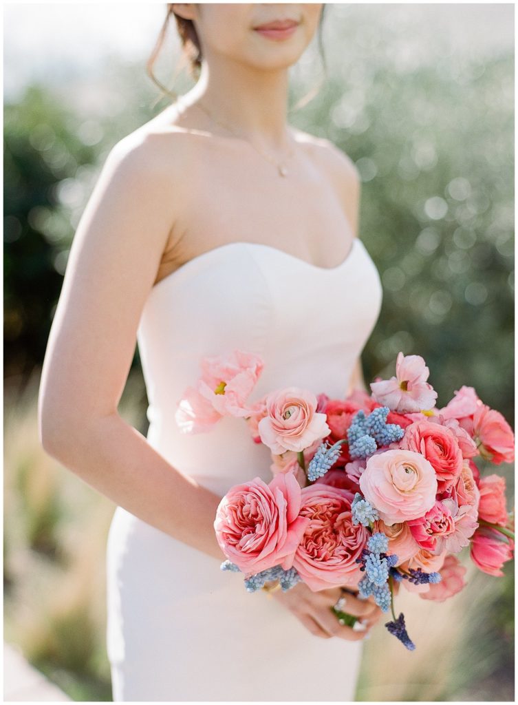 All floral bridal bouquet with poppies, ranunculus, garden roses by Gather Design Company
