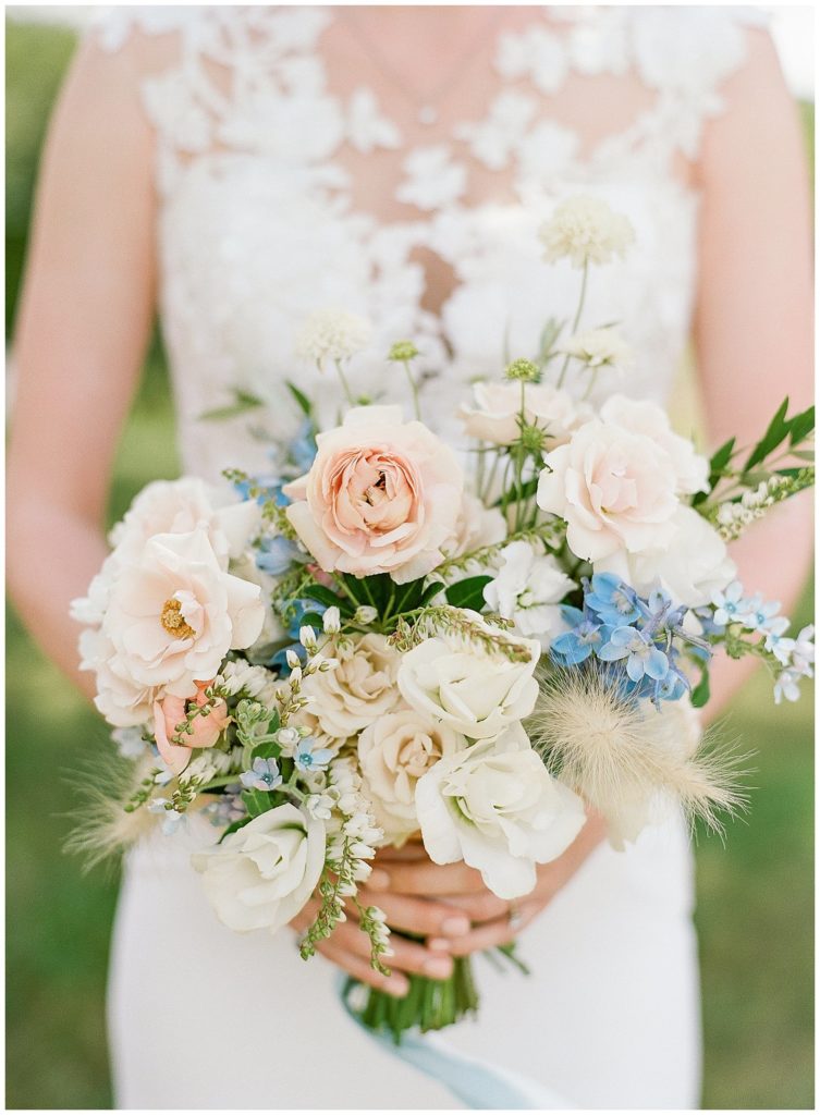 Blush and white bouquet with blue accents by Morrice Florist