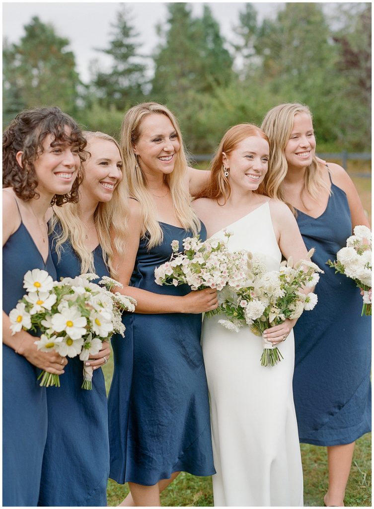 bridesmaids in navy blue silk dresses
