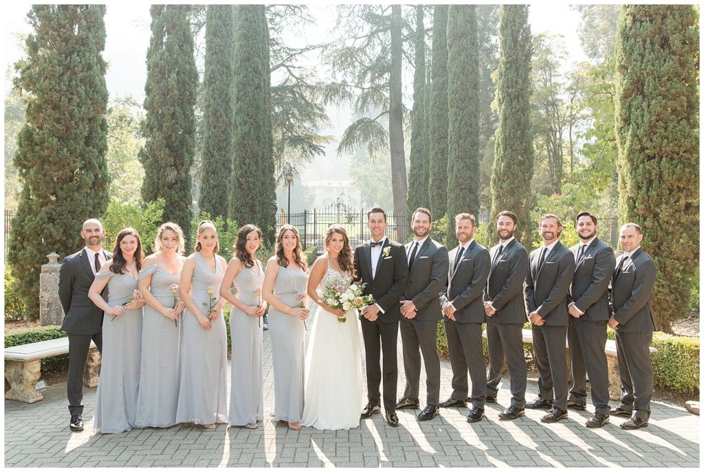 Bridesmaids in pale blue gray dresses from Dessy Group