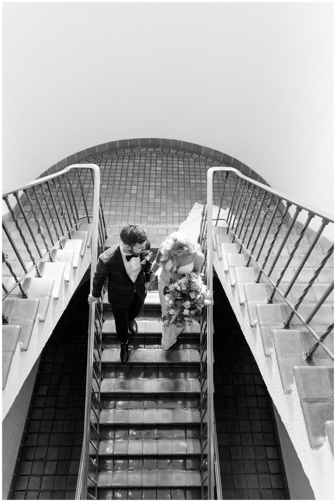 Couple descending stairs at the Vinoy after wedding