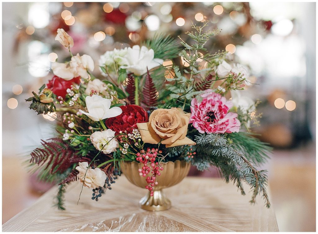 Centerpiece with pink and red florals for the holidays