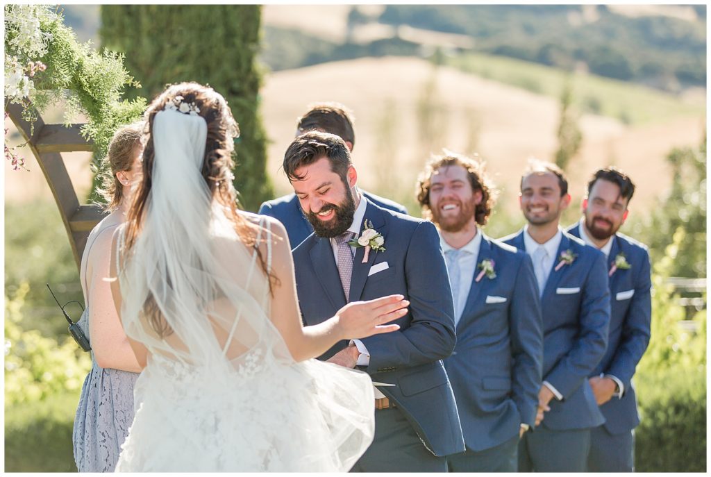 groom laughing during 