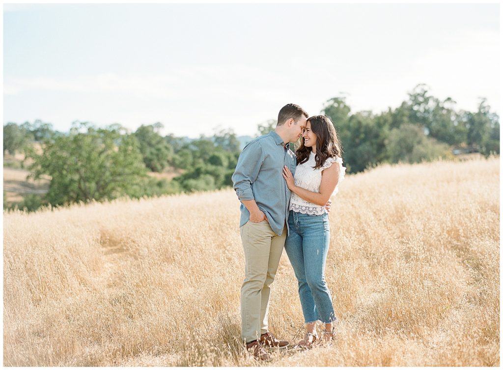casual engagement photos with jeans and white top