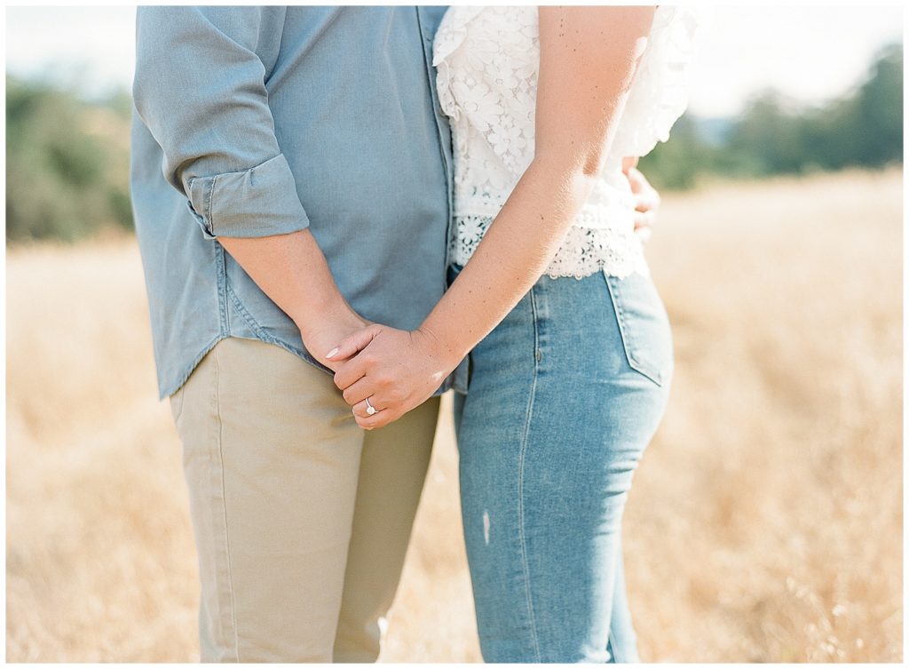 casual engagement photos with jeans and white top