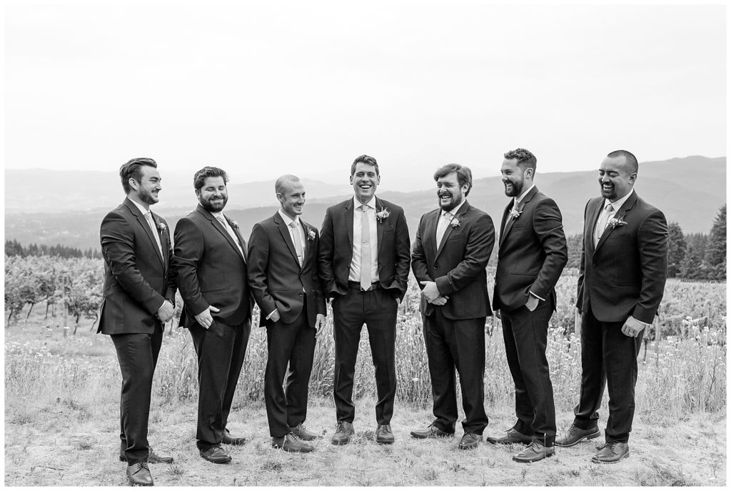 groomsmen laughing at Gorge Crest Vineyards