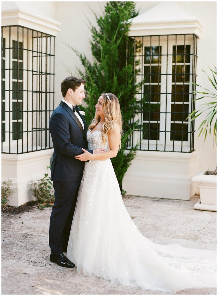 wedding portraits in front of rosemary cottage fisher island