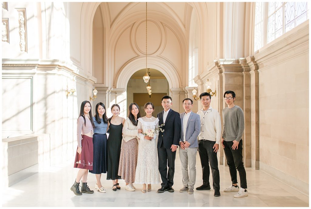 Photo of couple and friends at SF City hall during wedding