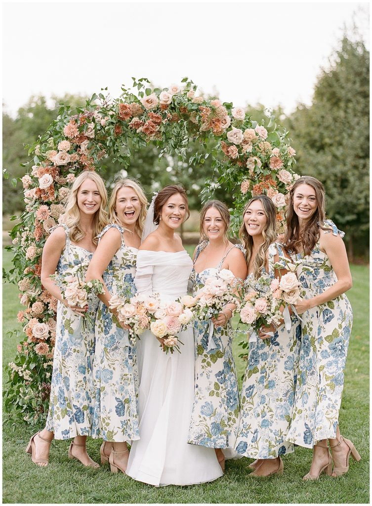 Bridesmaids with floral dresses from reformation for Bear Flag Farm wedding