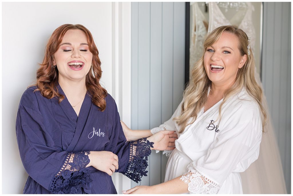 bride and bridesmaid in matching robes at Portola Hotel in Monterey
