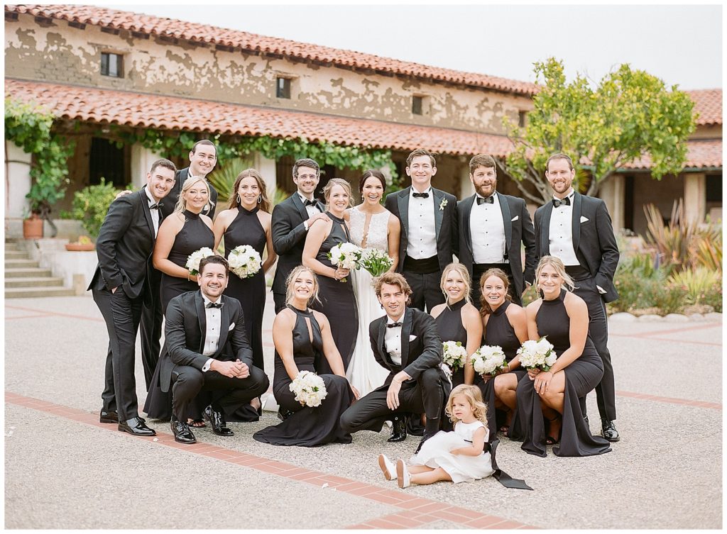 Bridesmaids in black for carmel mission basilica wedding