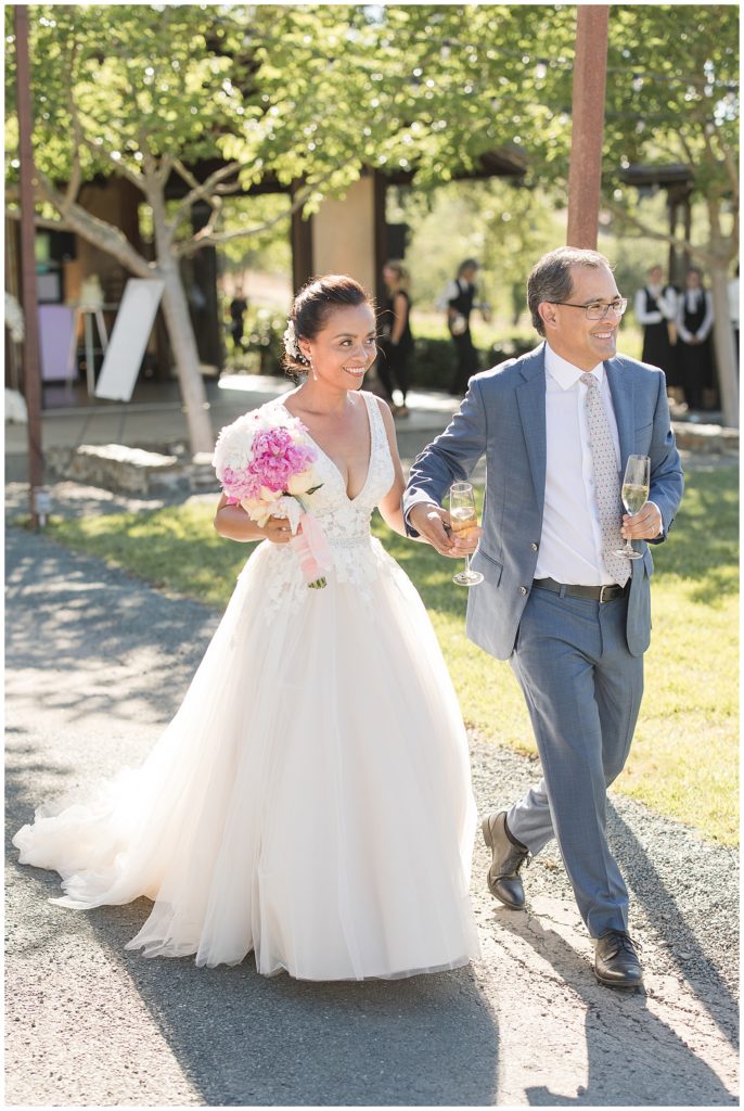 Couple entering wedding reception at Arista Winery